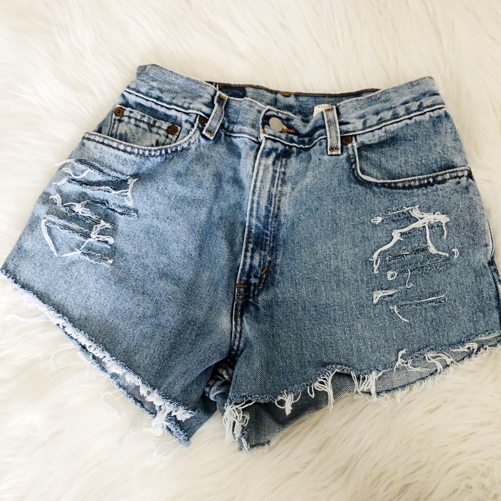Vintage Levi’s 550 distressed cut off jean shorts